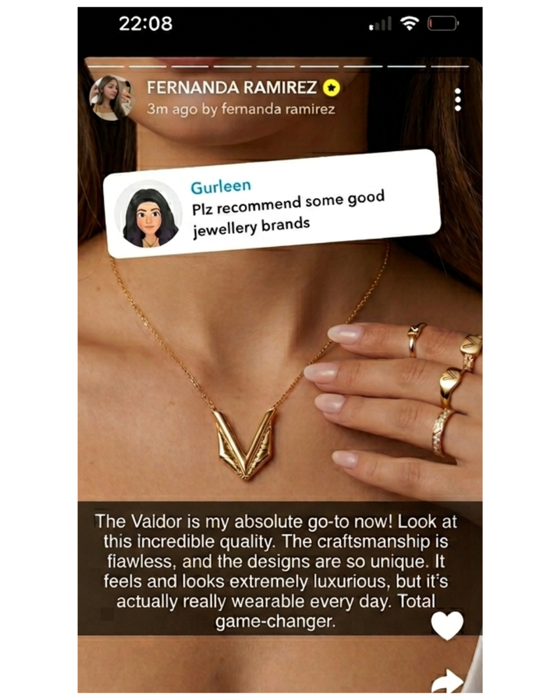 Close-up of a person wearing gold jewelry with a text overlay on a smartphone screen.