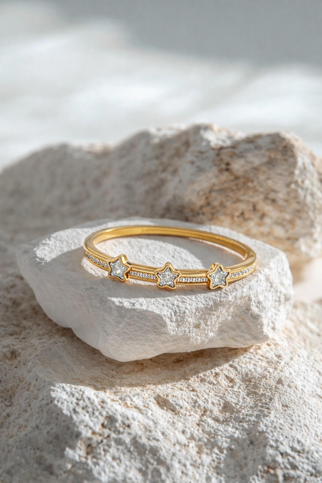Valdor Astryx star bracelet in gold finish with zirconia stones, elegant luxury bangle inspired by celestial design